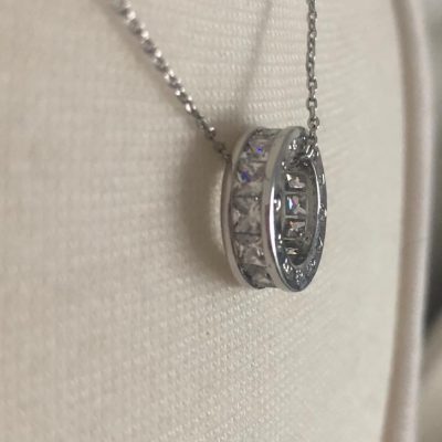 Silver Hollow Disc Necklace with Crystal Diamond Side Detail.