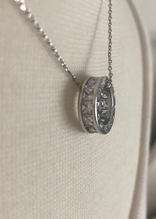 Silver Hollow Disc Necklace with Crystal Diamond Side Detail.